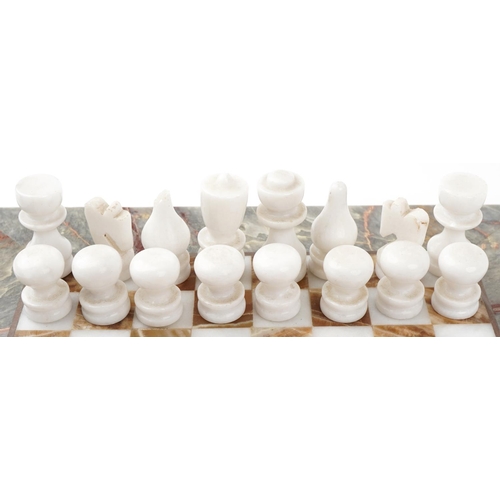 2025 - Mid to late 20th century marble chequer board together with two marble chess sets, the board 36cm x ... 