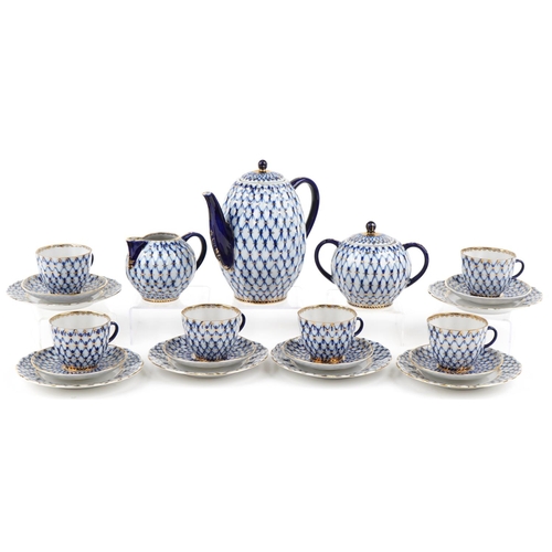 566 - Nine piece Lomonosov 'Cobalt Net' porcelain tea set, made in the USSR circa 1986 comprising six trio... 