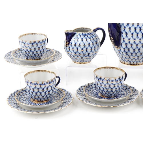 566 - Nine piece Lomonosov 'Cobalt Net' porcelain tea set, made in the USSR circa 1986 comprising six trio... 