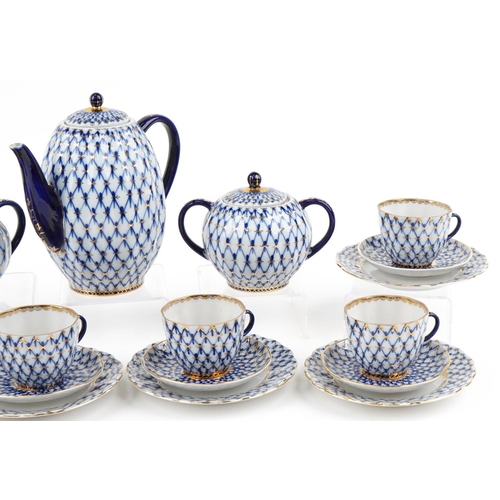 566 - Nine piece Lomonosov 'Cobalt Net' porcelain tea set, made in the USSR circa 1986 comprising six trio... 