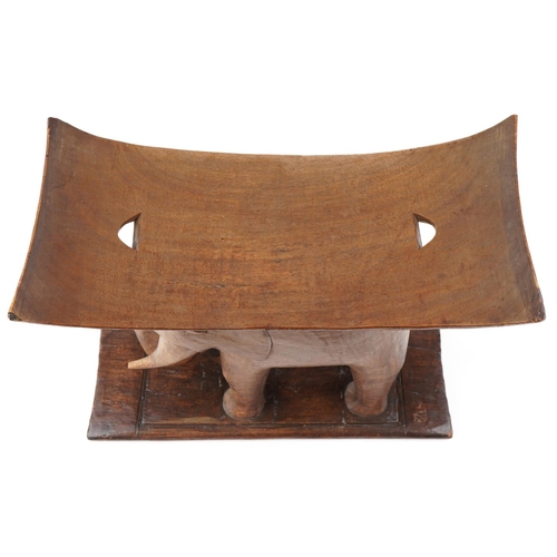 1044 - 20th century African Ashanti hardwood stool in the form of an elephant, 52cm H x 60cm W x 29cm D