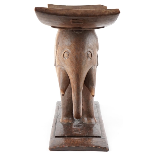 1044 - 20th century African Ashanti hardwood stool in the form of an elephant, 52cm H x 60cm W x 29cm D