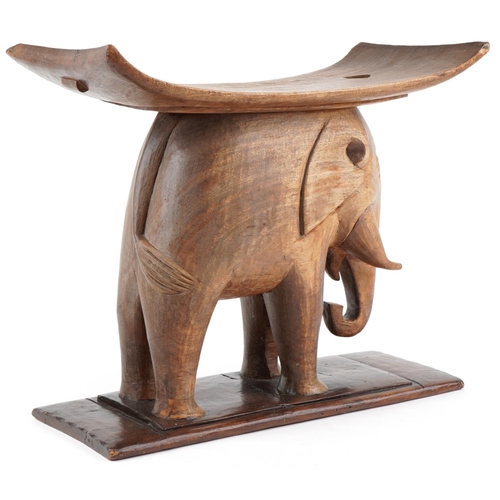 1044 - 20th century African Ashanti hardwood stool in the form of an elephant, 52cm H x 60cm W x 29cm D