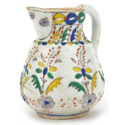 87 - Turkish Ottoman Kütahya glazed pottery milk jug, late 19th/early 20th century, hand painted with sty... 