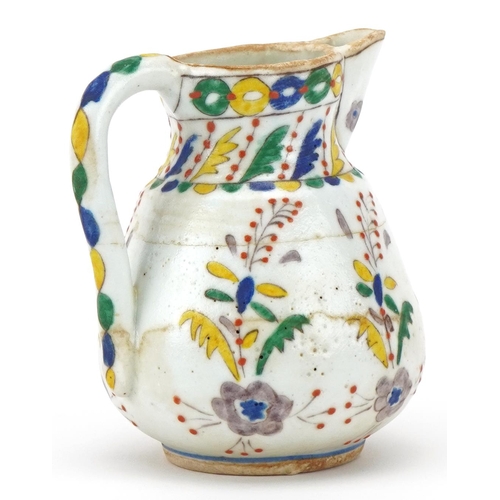 87 - Turkish Ottoman Kütahya glazed pottery milk jug, late 19th/early 20th century, hand painted with sty... 