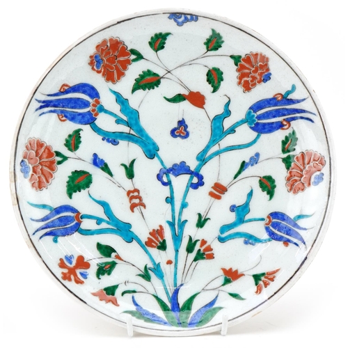 247 - Ottoman Turkish Iznik glazed pottery plate, 20th century, hand painted with stylized flowers, 25cm i... 