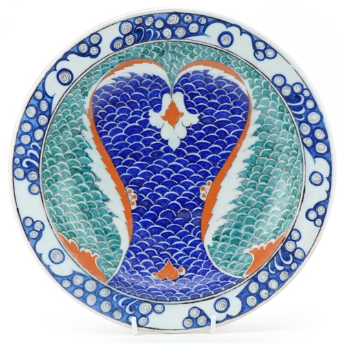 84 - Ottoman Turkish Iznik glazed pottery footed plate, 20th century, hand painted with stylized scales, ... 