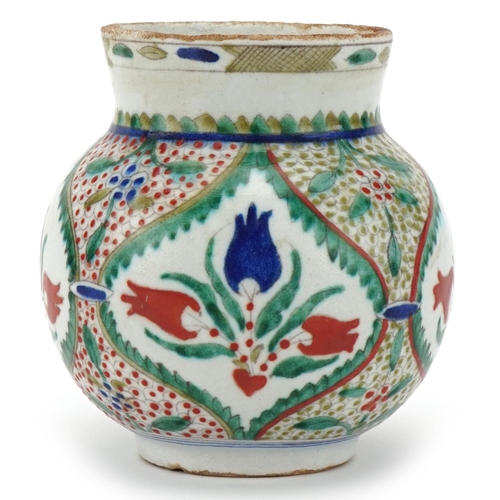 244 - Ottoman Turkish Kütahya glazed pottery vase, 20th century, of bulbous form, hand painted with styliz... 