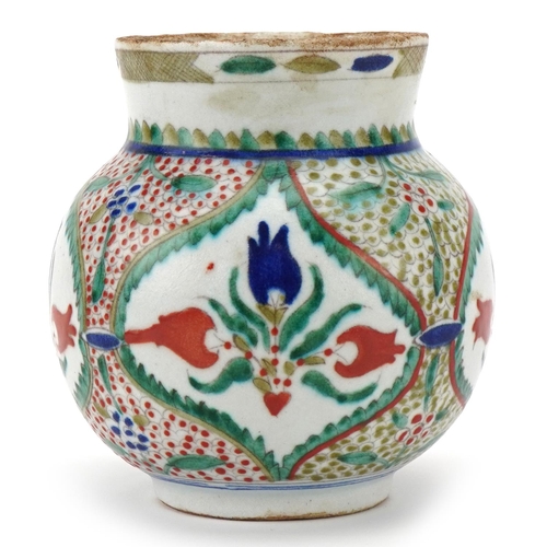 244 - Ottoman Turkish Kütahya glazed pottery vase, 20th century, of bulbous form, hand painted with styliz... 