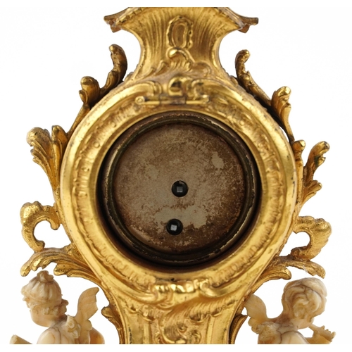 189 - Miniature Rococo style gilt spelter mantle clock mounted with ivory coloured Putti, 12cm high