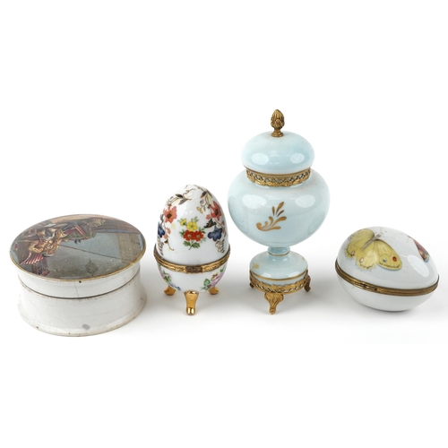 1233 - A Limoges, hand painted porcelain egg shaped box together with a similar, a Limoges lidded vase and ... 