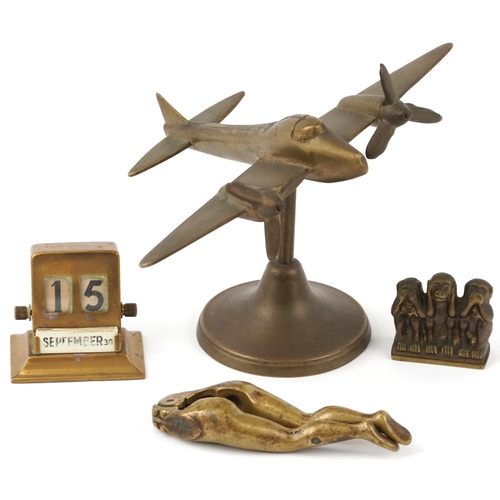 1151 - Small group of collectors items to include desk calendar, desk stand in the form of a twin propeller... 