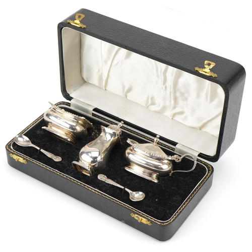 465 - Silver three piece condiment set with blue glass liners, Birmingham, 1962 by William Suckling Ltd, c... 