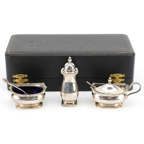 465 - Silver three piece condiment set with blue glass liners, Birmingham, 1962 by William Suckling Ltd, c... 