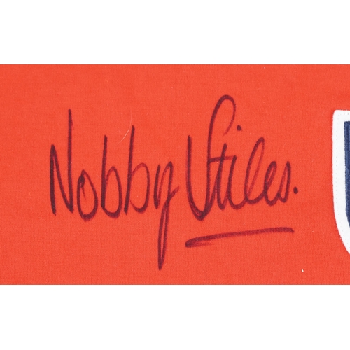 2402 - A group of four signed repilca sports jerseys provided by Style Entertainments to include Nobby Stil... 