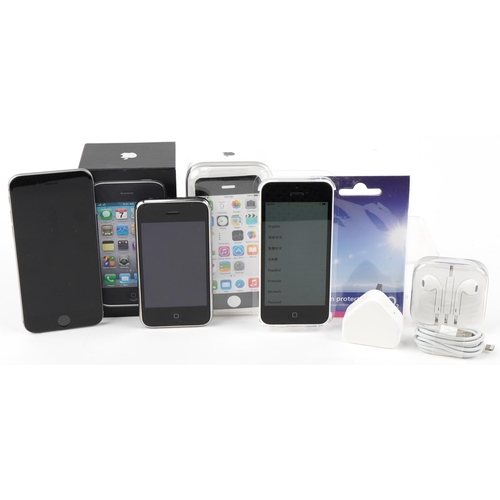 1129 - Three Apple iPhones, two with boxes, comprising 8GB iPhone 3GS model A1303, 8GB iPhone 5C model A150... 