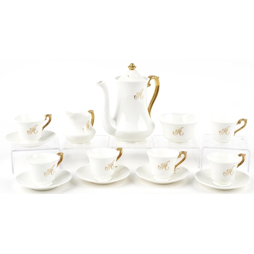 555 - Crescent part coffee service, each with gilt A monogram, retailed by George Jones & Sons, the coffee... 