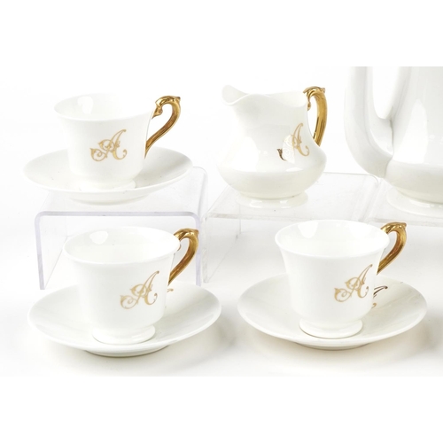 555 - Crescent part coffee service, each with gilt A monogram, retailed by George Jones & Sons, the coffee... 