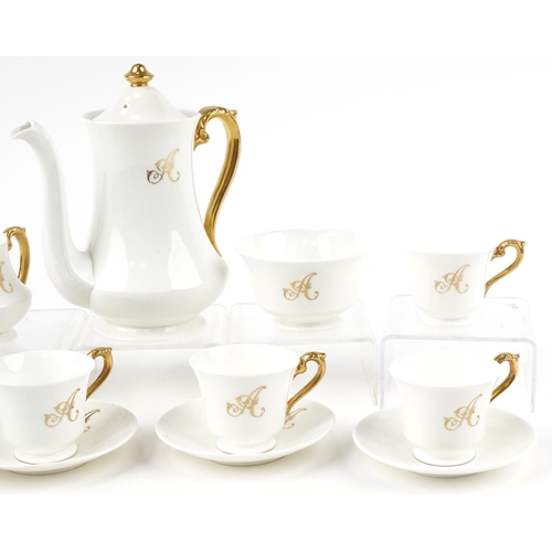 555 - Crescent part coffee service, each with gilt A monogram, retailed by George Jones & Sons, the coffee... 