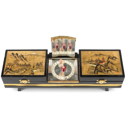 1173 - Japanese black lacquered musical jewellery box hand painted with views of Mount Fuji, 43cm in length