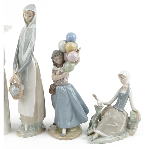 527 - Seven Lladro and Nao porcelain figures and animals including girl with geese, girl with balloons and... 