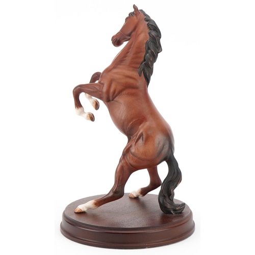 497 - Royal Doulton Spirit of the Wild figure of a rearing horse on a turned wooden base, H-31cm