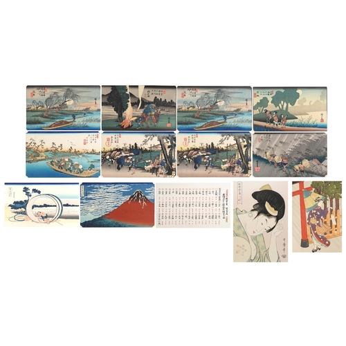 383 - Ten Japanese woodblock prints, mid 20th century, within a gilt folder, some with artist's signatures... 