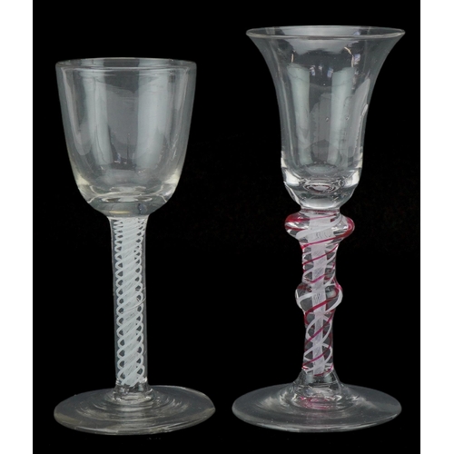 258 - Two 18th century Dutch wine glasses with opaque and coloured air twist stems, the largest 16cm high