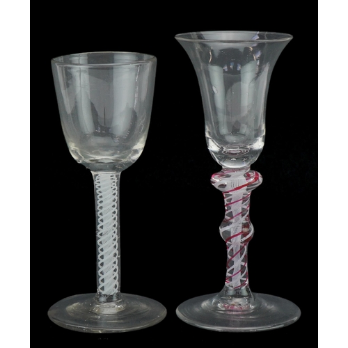 258 - Two 18th century Dutch wine glasses with opaque and coloured air twist stems, the largest 16cm high