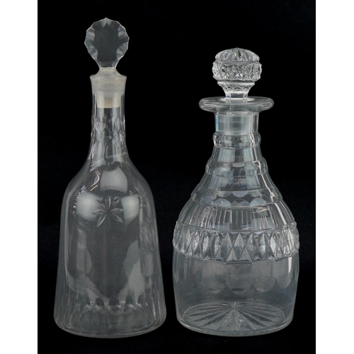 159 - Two Georgian cut glass decanters with stoppers, the largest 29cm high