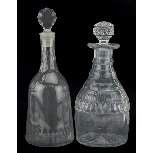 159 - Two Georgian cut glass decanters with stoppers, the largest 29cm high