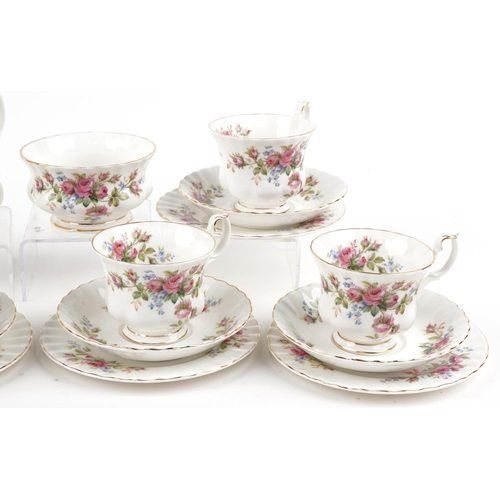 559 - Six Royal Albert Moss Rose trios with sugar bowl and milk jug, the largest 16cm in diameter