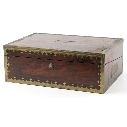 338 - Regency rosewood and brass inlaid writing slope, the hinged top revealing a blue gilt tooled leather... 