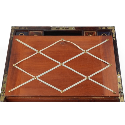 338 - Regency rosewood and brass inlaid writing slope, the hinged top revealing a blue gilt tooled leather... 