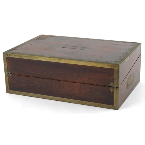 338 - Regency rosewood and brass inlaid writing slope, the hinged top revealing a blue gilt tooled leather... 