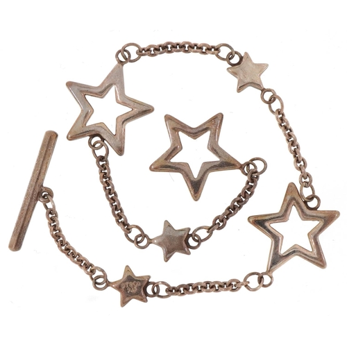 3106 - Tiffany & Co .925 silver bracelet of star link form together with a Tiffany pouch, box and bag.