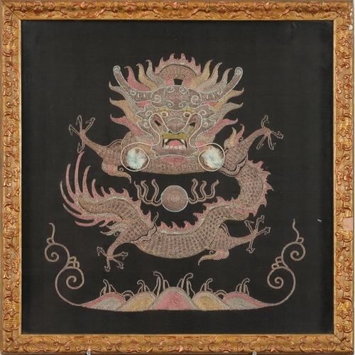 382 - Chinese embroidery, 20th century, of a Chinese dragon on a black silk background within a late 19th ... 