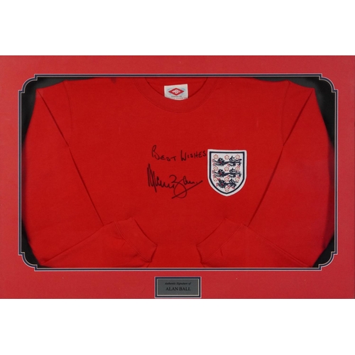 2485 - Signed replica England jumper signed by Alan Ball, framed and glazed, 87cm x 62cm