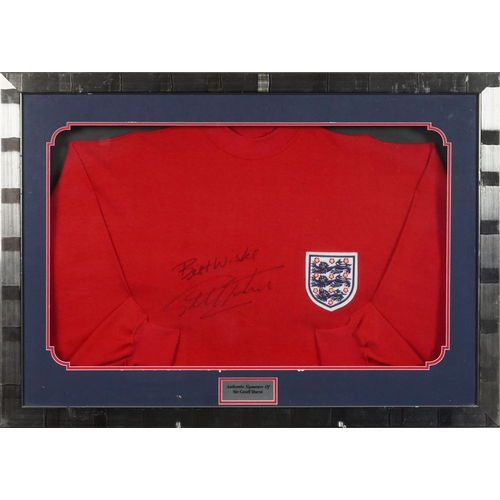 2486 - Signed replica England jumper by Sir Geoff Hurst, framed and glazed, 87cm x 62cm, together with a Wo... 