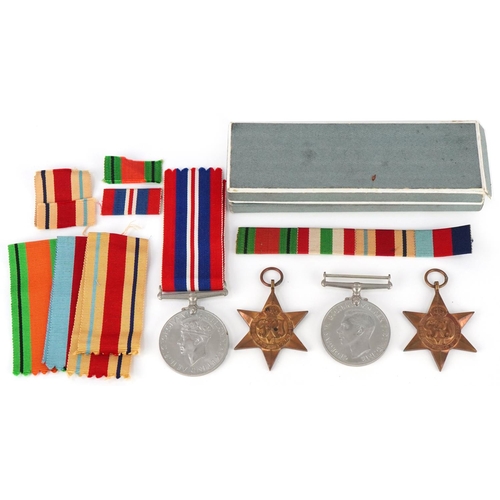 2519 - Four British military World War II medals with ribbons and a bar