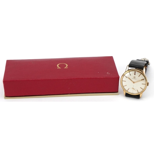 3058 - Omega gilt metal cased gentlemen's wristwatch with black leather strap, the dial 3.5cm, boxed.