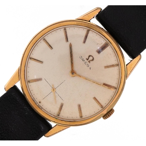 3058 - Omega gilt metal cased gentlemen's wristwatch with black leather strap, the dial 3.5cm, boxed.