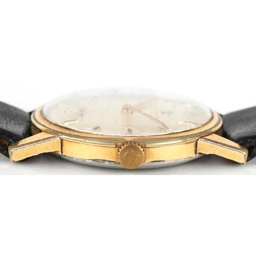 3058 - Omega gilt metal cased gentlemen's wristwatch with black leather strap, the dial 3.5cm, boxed.