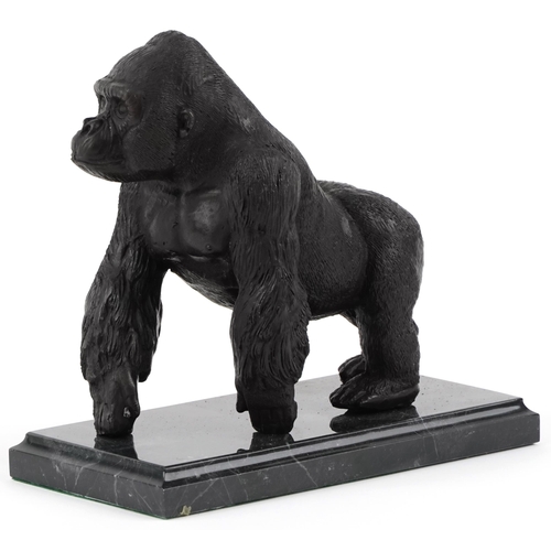 283 - Patinated bronze study of a gorilla raised on a black marble base, 20cm in length