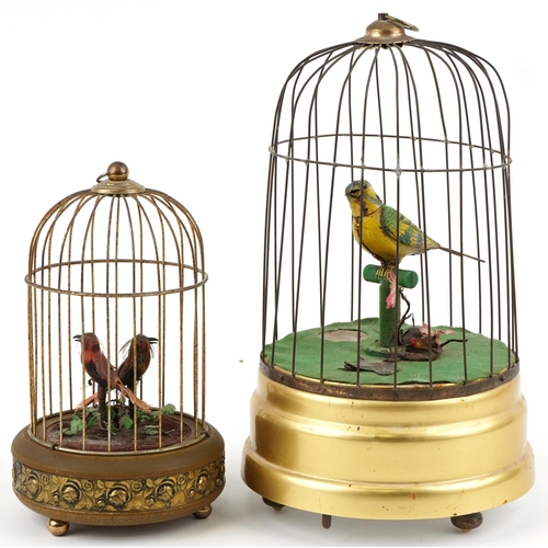 10 - 20th century tinplate musical automaton bird in a cage, probably German, 34cm high, together with a ... 