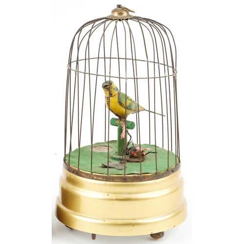 10 - 20th century tinplate musical automaton bird in a cage, probably German, 34cm high, together with a ... 