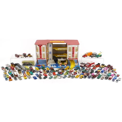 2036 - International plastic toy garage together with a large collection of unboxed diecast models includin... 