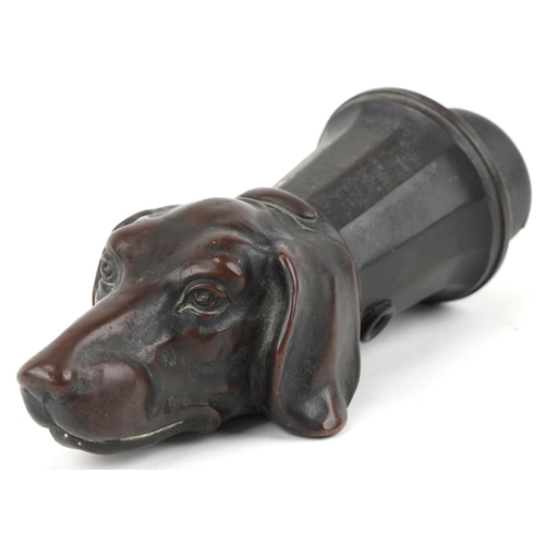 11 - Early 20th century brown patinated bronze light fitting in the form of a dog's head, 17cm in length