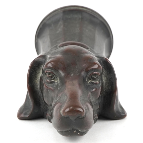 11 - Early 20th century brown patinated bronze light fitting in the form of a dog's head, 17cm in length