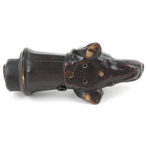 11 - Early 20th century brown patinated bronze light fitting in the form of a dog's head, 17cm in length